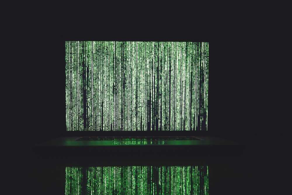 Random data in green glowing text on wall