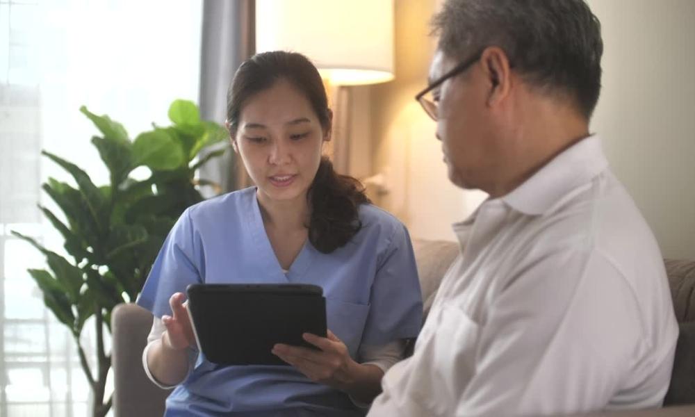 NDIS nurse helping man