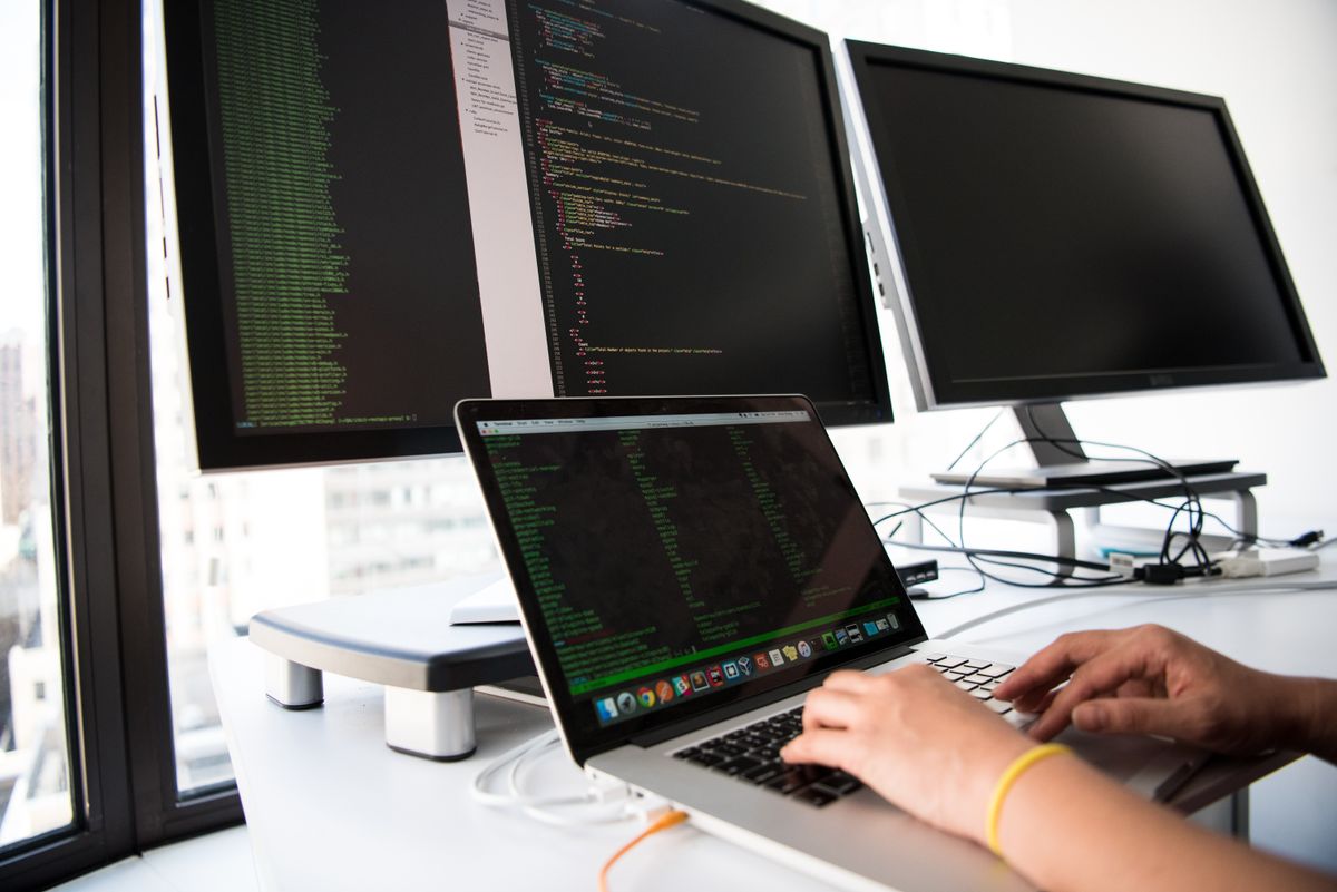 Developer working on code in an office