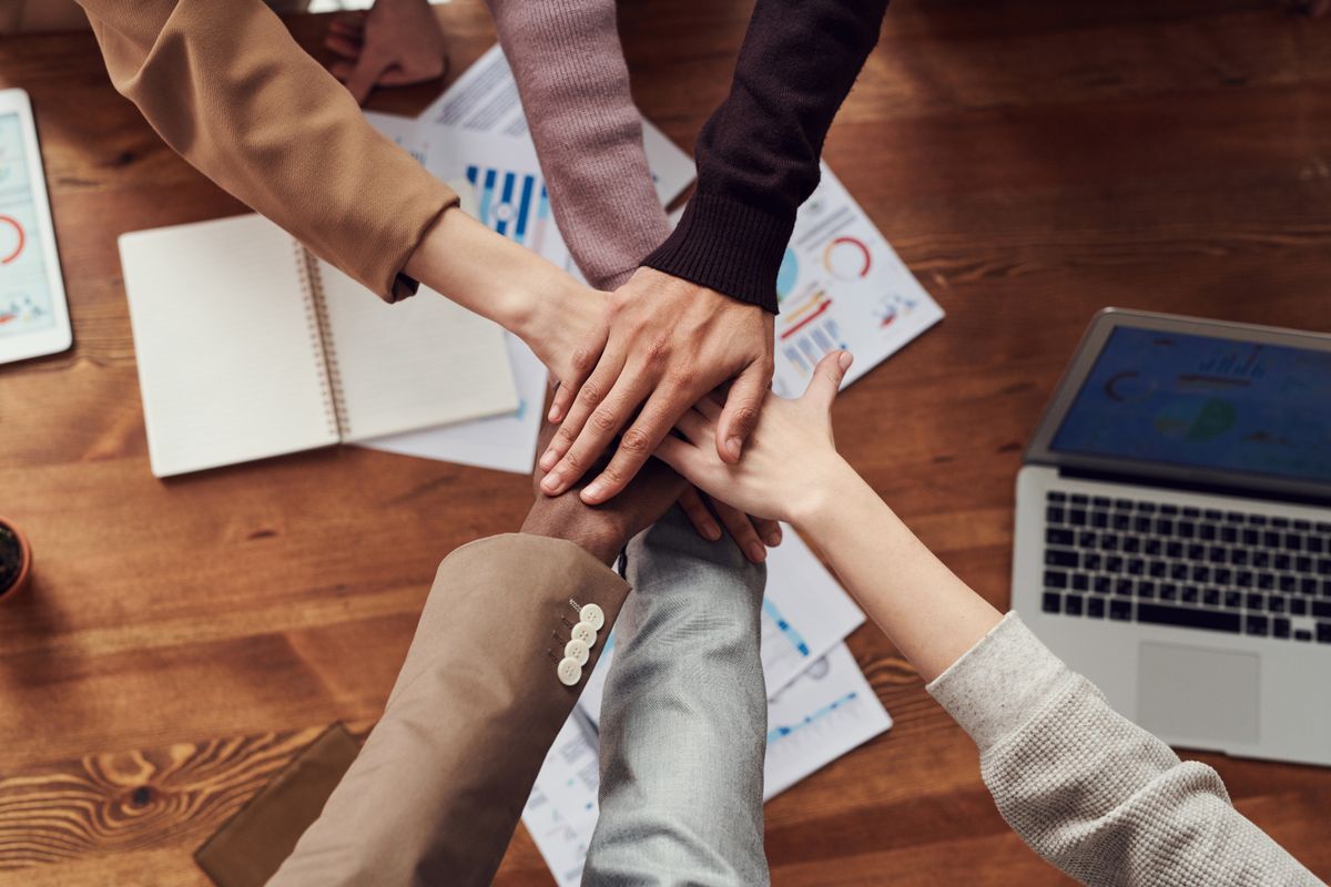 Colleagues collaborating around a table in a modern office