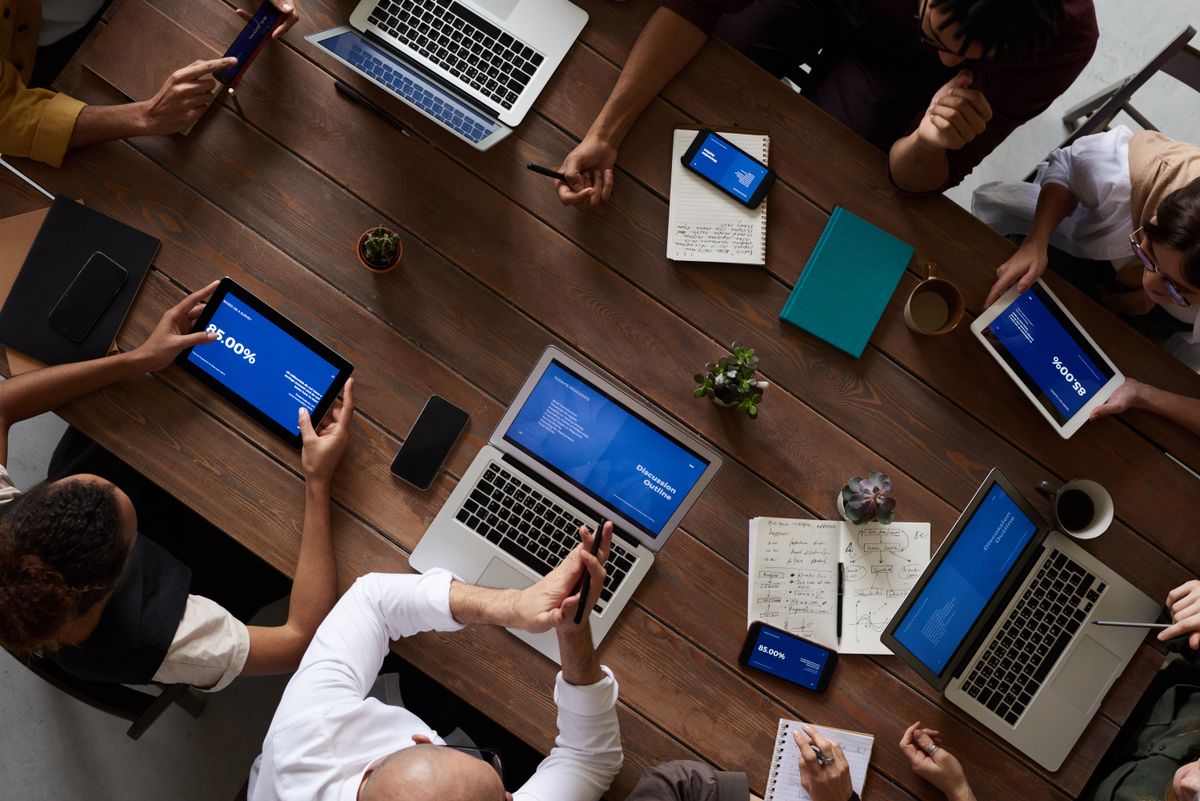 Business team celebrating together around a table